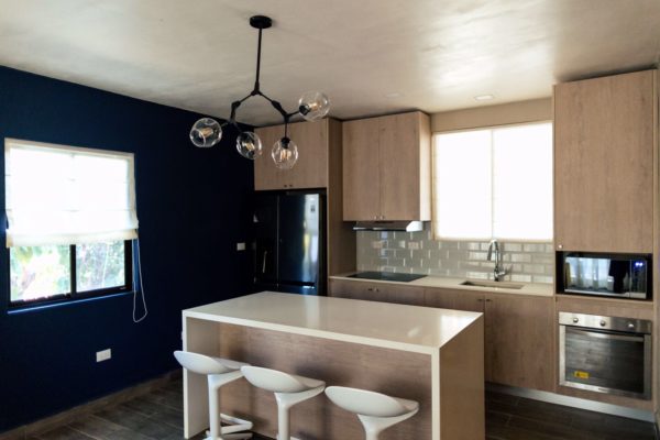 view of the kitchen and blue accent wall