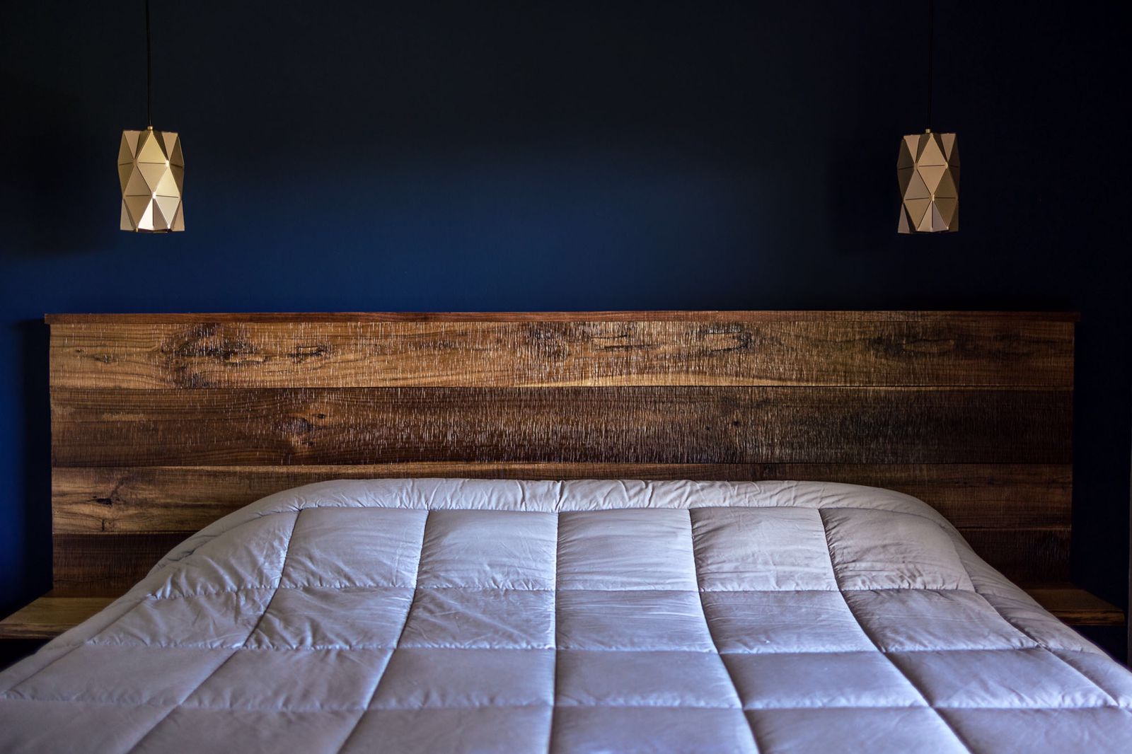 dark blue accent wall in the bedroom