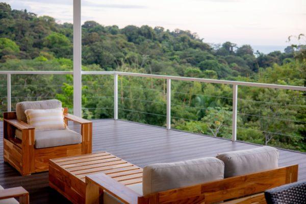 View from the balcony with comfortable wooden patio furniture