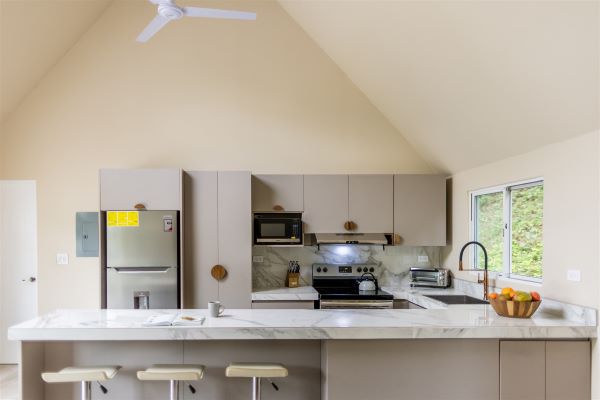 kitchen area with a long breakfast bar